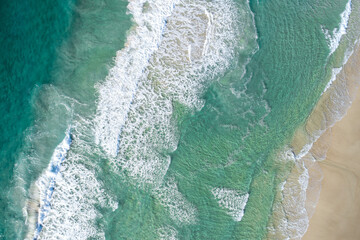 Stunning aerial view of a beach with pristine blue water