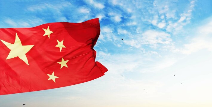 Flag of China waving in the wind, sky and sun background. Chinese Flag 3d rendering.