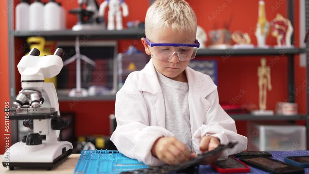 Poster Adorable toddler technician repairing smartphone at classroom