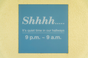 Destin, Florida- Sign on a wall with Shhhh... It's quiet time in our hallways- 9 p.m- 9 a.m