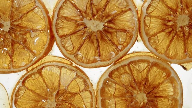 Pattern dried orange slices seamless dripping caramel drops sweet sauce or honey. Dehydrated dry citrus and flowing yellow orange tasty syrup drip. Confectionery, cooking handmade dessert and candies
