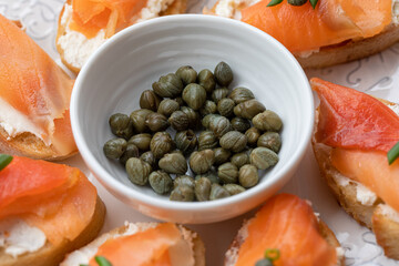 canapé with salmon. closeup of capers