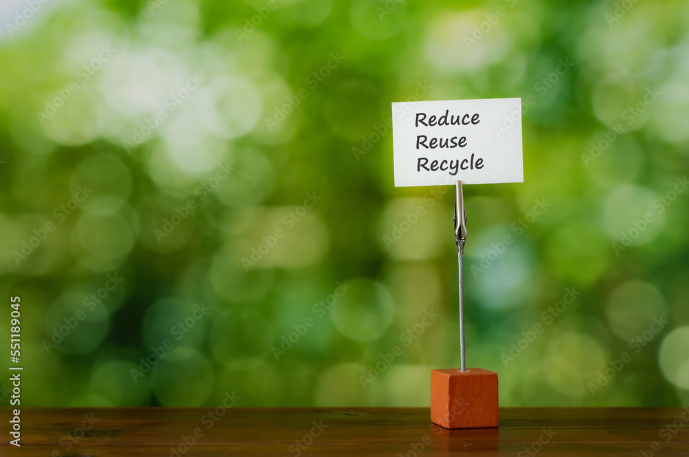 Poster there is piece of paper with the word reduce reuse recycle.