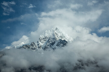 clouds in the mountains in himalayas, nepal - obrazy, fototapety, plakaty