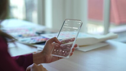 modern woman using futuristic smartphone to scroll through the cryptocurrency market - Powered by Adobe