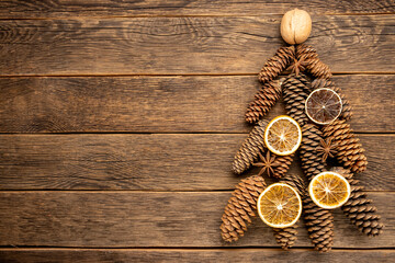 Christmas creative tree decorated with fir, anise stars, cones. Eco decoration.