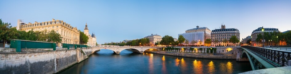 Seine river canal overlooking exchange bridge near Conciergerie palace and prison in Paris. France