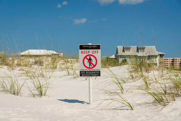 Protected Area Keep Off signpost on a white sand dunes at Destin, Florida