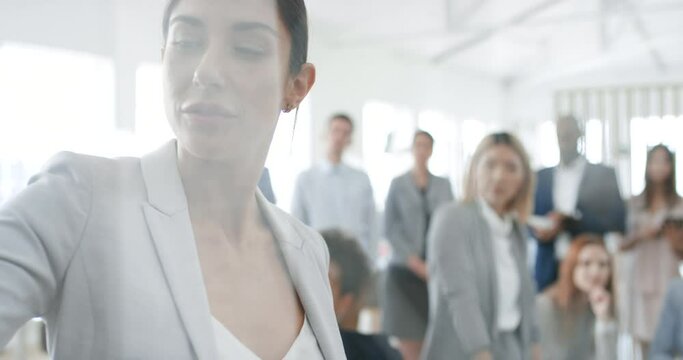 Presentation, meeting and female leader writing on a glass board for team coaching, training or education. Collaboration, teamwork and workshop with a business woman leading a strategy session