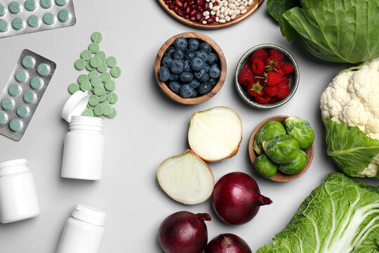 Many Prebiotic Pills And Food On Grey Background, Flat Lay