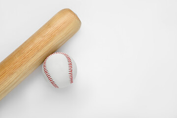 Wooden baseball bat and ball on white background, top view with space for text. Sports equipment