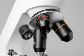 Fototapeta na wymiar Closeup view of modern medical microscope on grey background