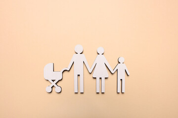 Figures of family on beige background, top view. Insurance concept