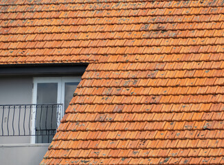 Clay tile roof with terrace balcony