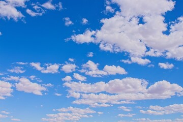 Vivid blue sky filled with fluffy white clouds