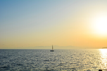 Naklejka na ściany i meble Sunset over the sea and yacht on summer, Shonan, Kanagawa, Japan