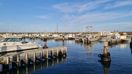 a boat is docked next to a body of water