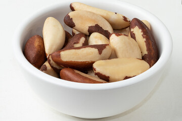 Typical Brazilian nut known as Castanha do Pará in a bowl. Selective focus.