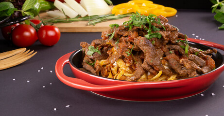 Turkish food lamb meat saute, sac kavurma with and french fries