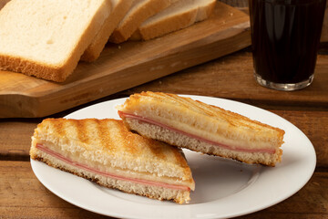 Toasted bread stuffed with mortadella and cheese. Selective focus.
