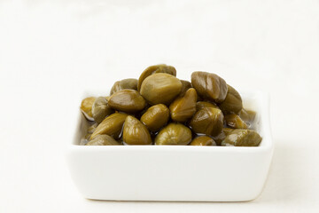 Capers isolated on white background.