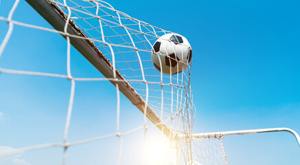 Football goal net against blue sky