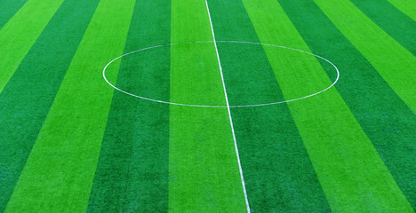 Obraz premium Green grass soccer field for background