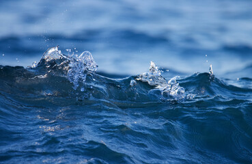 Dark blue ocean wave closeup. Sea wave on beach.