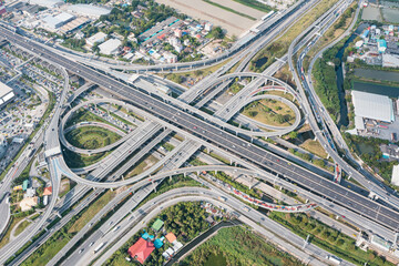 Multilevel junction motorway top view, Road traffic an important infrastructure in Thailand.Expressway Road and Roundabout.Transportation and travel concept.