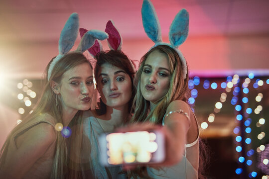 Phone, party or friends take a selfie for a social media profile picture on girls night in celebration of a happy birthday. Faces, freedom or young gen z women taking pictures for online content