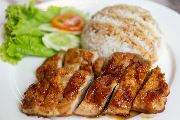 Grilled chicken with teriyaki sauce and rice.