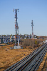RF Communication transmission towers under cloudy sky