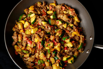 Chopped vegetables for Ratatouille in a frying pan.