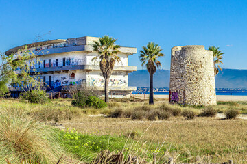 Old hospital and the Spanish Tower on Poetto beach. Cagliari, Sardinia, Italy