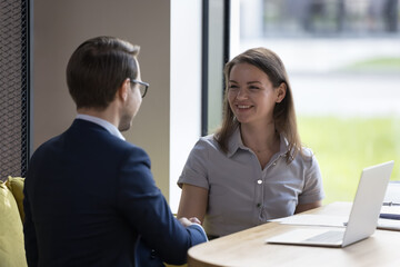 Two businesspeople shake hands, making profitable commercial deal, finish formal meeting in company office, sales manager and client welcoming each other, smile express respect, showing appreciation