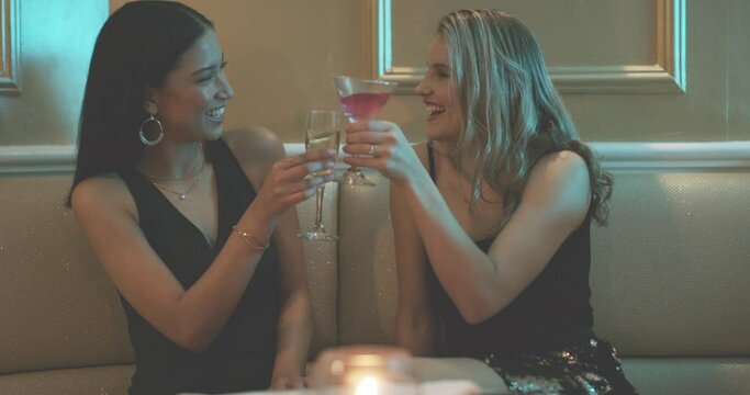 Cocktail, relax and friends toast at party in celebration of a happy birthday or social event with drinks. Party, smile or excited women drinking alcohol cheers to celebrate success in nightclub vip