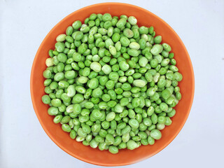 Green pigeon pea beans isolated on background, Green Toor Dal in orange bowl