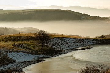 Early winter mountain lake landscape in Apuseni Romania