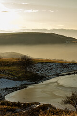 Early winter mountain lake landscape in Apuseni Romania