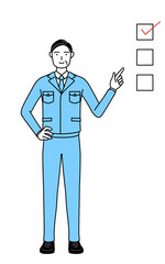 チェックリストを指さす作業着を着た男性（経営者、管理職、工場長）