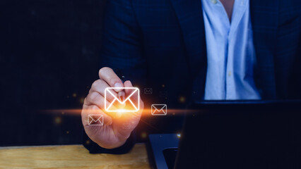 Businessman touching checking email online with virtual interface technology.Direct marketing, online message, E-mail, electronic mail,communication concept.