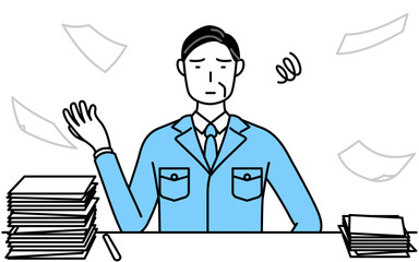 片付かない業務にうんざりする作業着を着た男性（経営者、管理職、工場長）