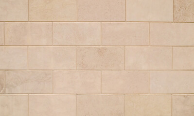 Shell stone tile wall as background.Old natural block wall with rough surface