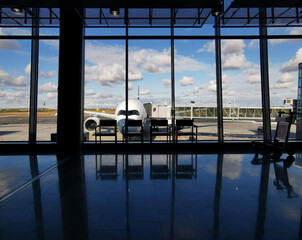 Departure and arrival terminal gate in a modern International airport of Helsinki finland .