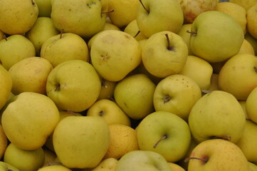 yellow apples in a market