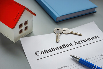 Cohabitation agreement, keys and model of home. - obrazy, fototapety, plakaty
