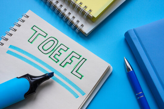 Handwritten TOEFL Test of English as a Foreign Language in the notepad.  foto de Stock | Adobe Stock