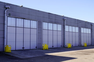 warehouse industrial building Exterior facade with semi truck loading dock door entrance