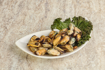 Tasty marinated mussels in the bowl