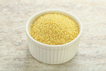 Raw couscous in the bowl